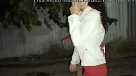 Two Girlfriends Pee Together by Car in Public Parking Lot