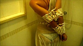 Old slave bound in bondage during shower pissing