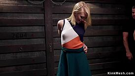 Masochistic blonde slave endures hardcore training in dark dungeon.
