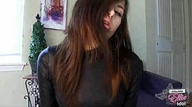 brunette femdom dominates with gloves, forcing anal on small cock in humiliation.