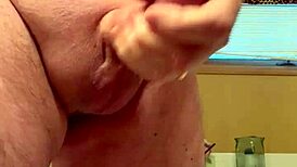A 65-year-old man passionately masturbates his average cock in a homemade close-up