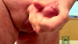 A 65-year-old man passionately masturbates his average cock in a homemade close-up