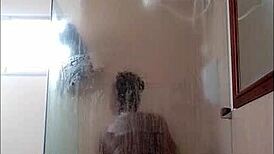 Ebony milf drops dildo in shower blowjob