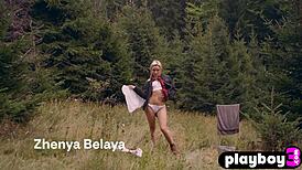 Petite blonde milf Zhenya Belaya strips outdoors, clothes ripped.