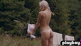 Petite blonde milf Zhenya Belaya strips outdoors, clothes ripped.