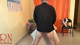 the masseur works over a submissive girl