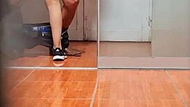 Hidden cam catches the secretary in her office routine