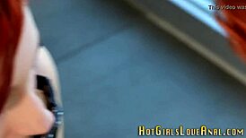 Redhead lesbian fingers and toys babe's ass in anal play.