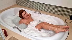 ruivinha teasing in jacuzzi before sucking black cock