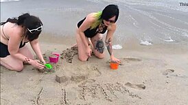 Beautiful women in bikinis at the beach in a photo shoot.