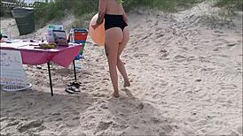 Beautiful women in bikinis at the beach in a photo shoot.