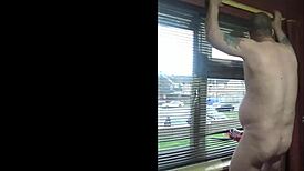 shy gay amateur masturbates naked by the window at home