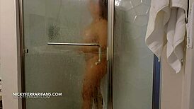 Nicky Ferrari spied on while bathing in steamy solo shower