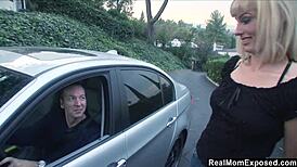 this blonde milf is bent over sucking a huge cock on the road