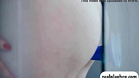 Beautiful women pleasure themselves with a blue dildo.