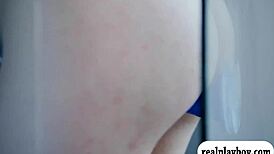 Beautiful women pleasure themselves with a blue dildo.