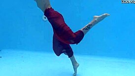 Petite brunette swims in the pool and enjoys sensual pleasures.