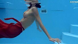Petite brunette swims in the pool and enjoys sensual pleasures.