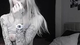 pale slim tattoo camgirl flashes her tits on cam