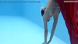 Petite brunette swims in the pool and enjoys sensual pleasures.