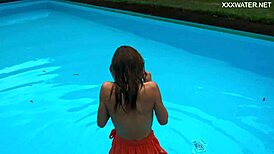 Petite brunette swims in the pool and enjoys sensual pleasures.
