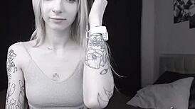 pale slim tattoo camgirl flashes her tits on cam