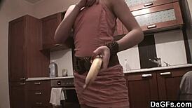 Dagfs freckled babe teases with dildo on kitchen counter