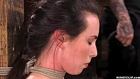 Submissive slave sucks cock while bound in upside down suspension for intense fetish play