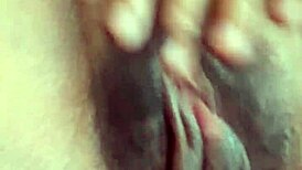 Wow, this sexy petite morena masturbates her wet hairy pussy on the bed!