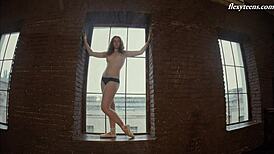 Rita Pervorazova flexes nude in gym