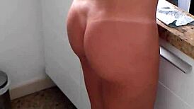 Amateurs in bikinis cooking in the kitchen.