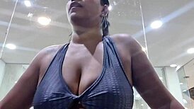 woman sweats in gym and gifts sweaty panties and feet post-workout