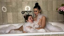 Nelly Kent and Gina Gerson share a steamy lesbian fuck in the bathroom