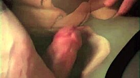 Vintage scene with one mouth handling two hard cocks