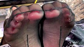 Goddess feet tease in cute black pantyhose up close