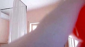 Elsa cosplay performer engages in a homemade parody scene with amateur actors