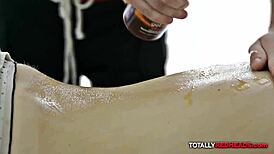 Relaxing oiled massage for a vibrant redhead in a serene spa setting
