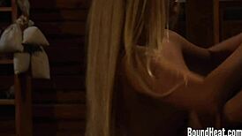 The huntress feeds her bound slave while inspecting the new european girl in leather bondage.