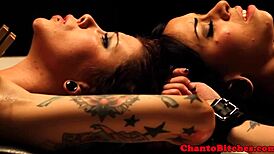 Lezdom Mistress Oversees Submissive Participants