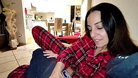 Wife chats quietly with friend while husband rests nearby