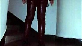 Hey, check out this leather catsuit with pantyhose and miniskirt combo.