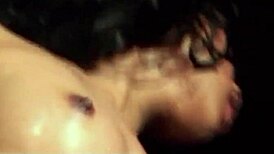 Asian brunette couple in latex and chains fucks doggystyle until facial in BDSM dungeon.