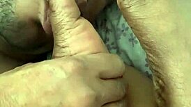 I'm sucking my wife's toes as she jerks me off