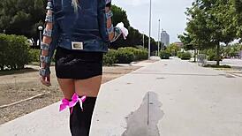 public squirt session unfolds on a sunny beach