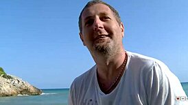 busty cougar shares her huge tits with a stranger on beach