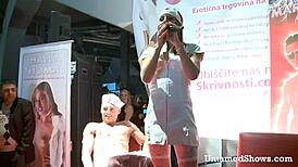 Hot nurse strips and swallows cock on stage
