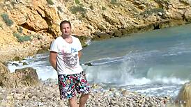 busty cougar shares her huge tits with a stranger on beach