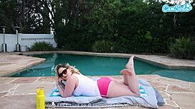 i'm a blonde hot milf oiling up my big tits and masturbating pussy by the pool for orgasm