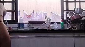 She washes the sink in just her panties at her father-in-law's house, flashing her big ass.