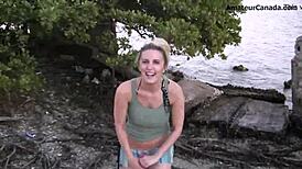 Teen blonde in bikini does a flashing striptease by the beach. Public fun unfolds!